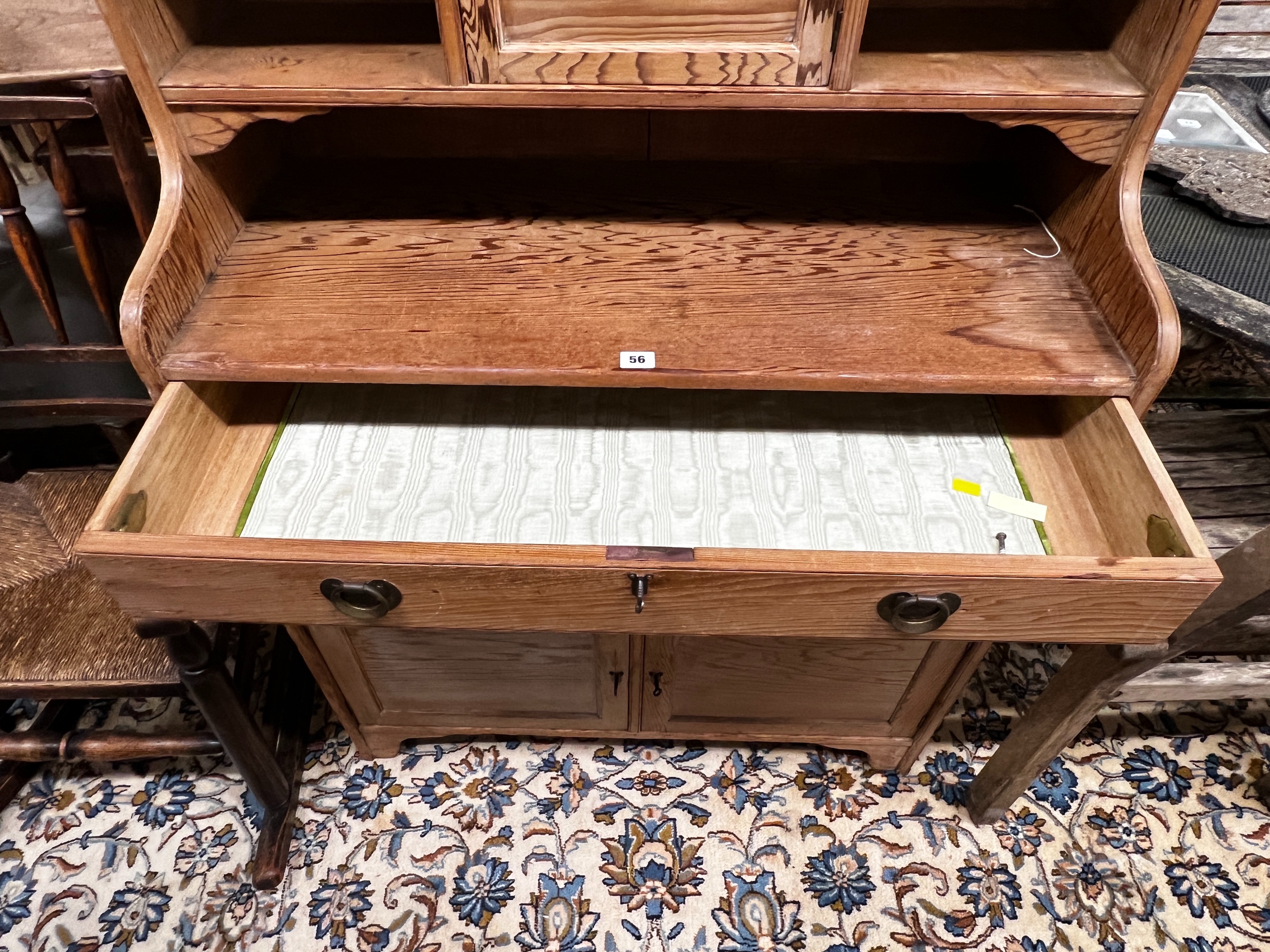 An Arts & Crafts pitch pine dresser with secretaire drawer, length 92cm, depth 41cm, height 220cm